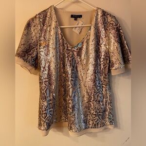 Maven West sequin top in reptile pattern; cream and purple shades
